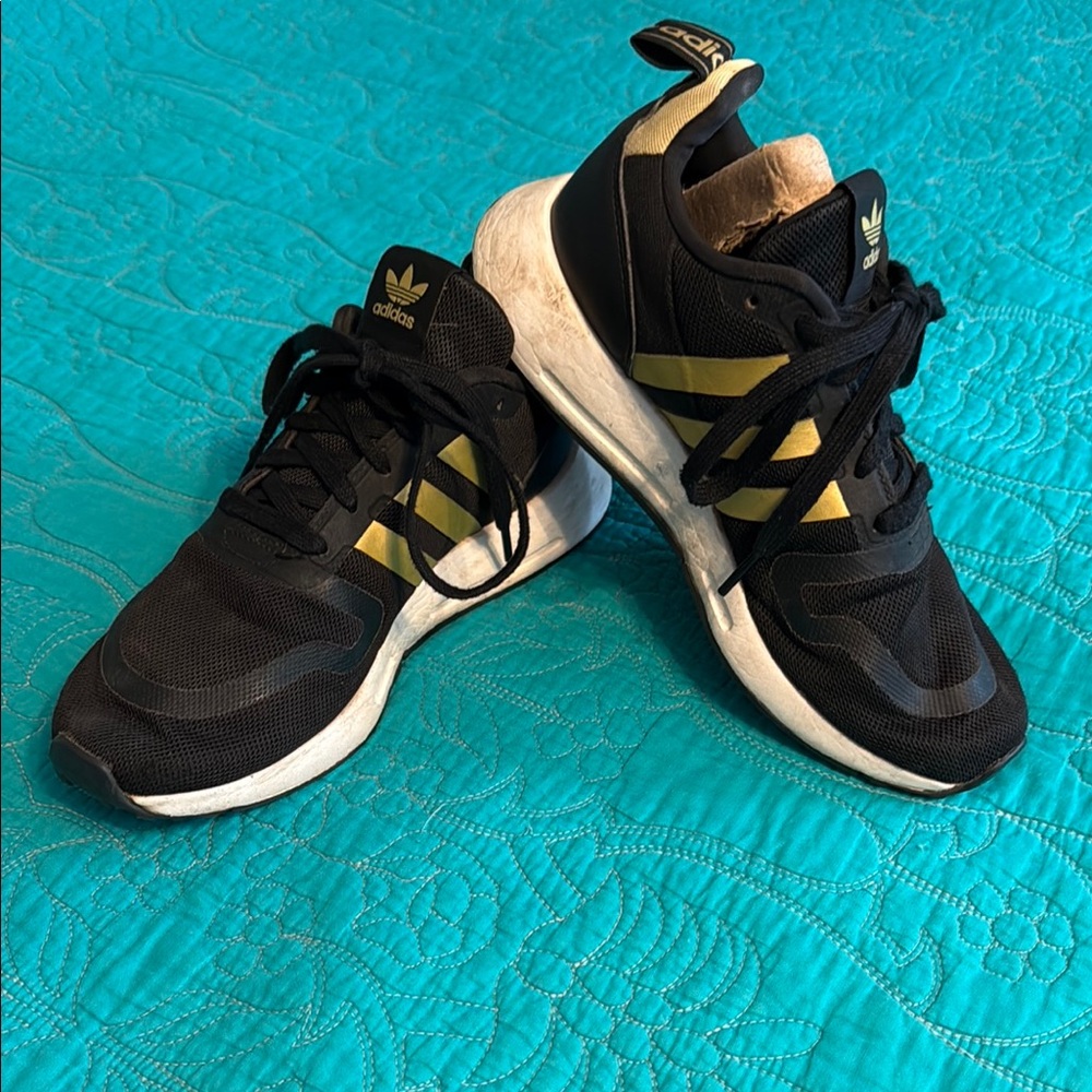 Adidas Black Sneakers with Gold Stripes